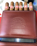 H Upman leather embossed leather travel humidor to hold 6 Robusto cigars .
